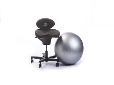 grey exercise ball sitting beside a corechair